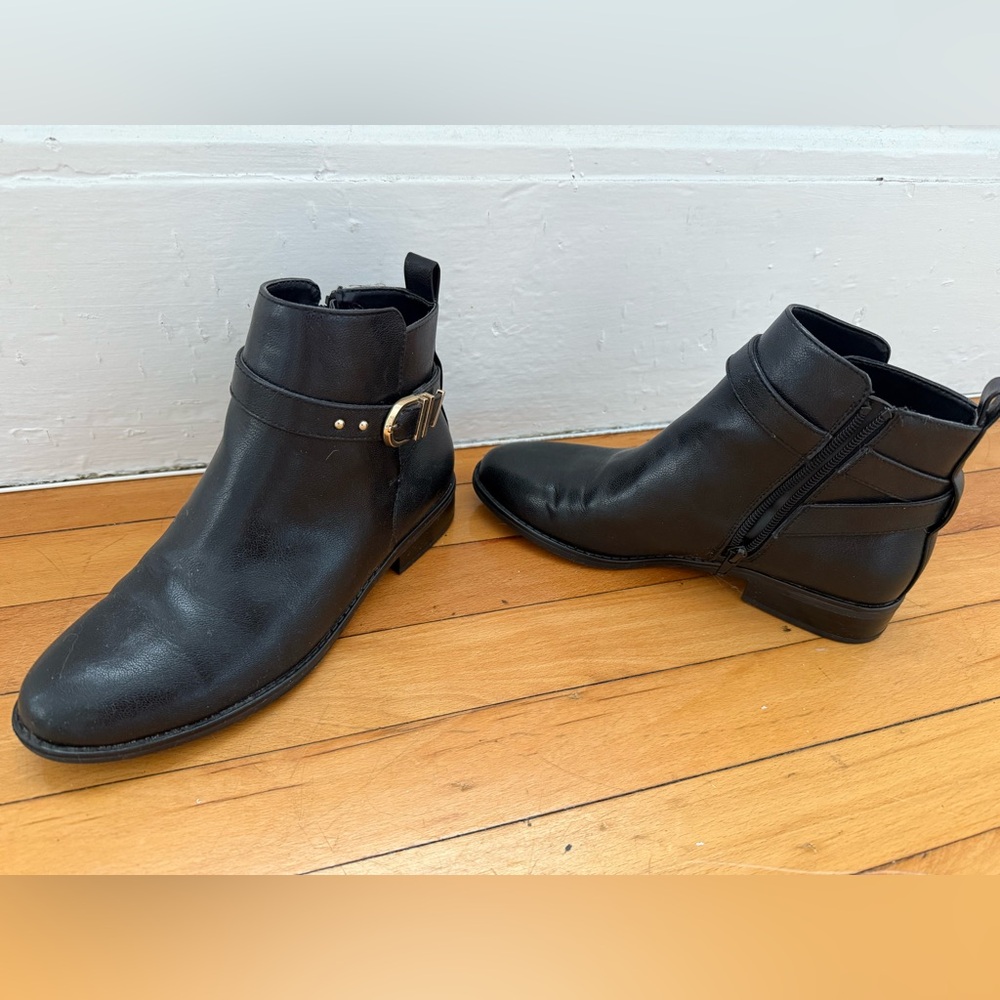 Black booties with gold accents